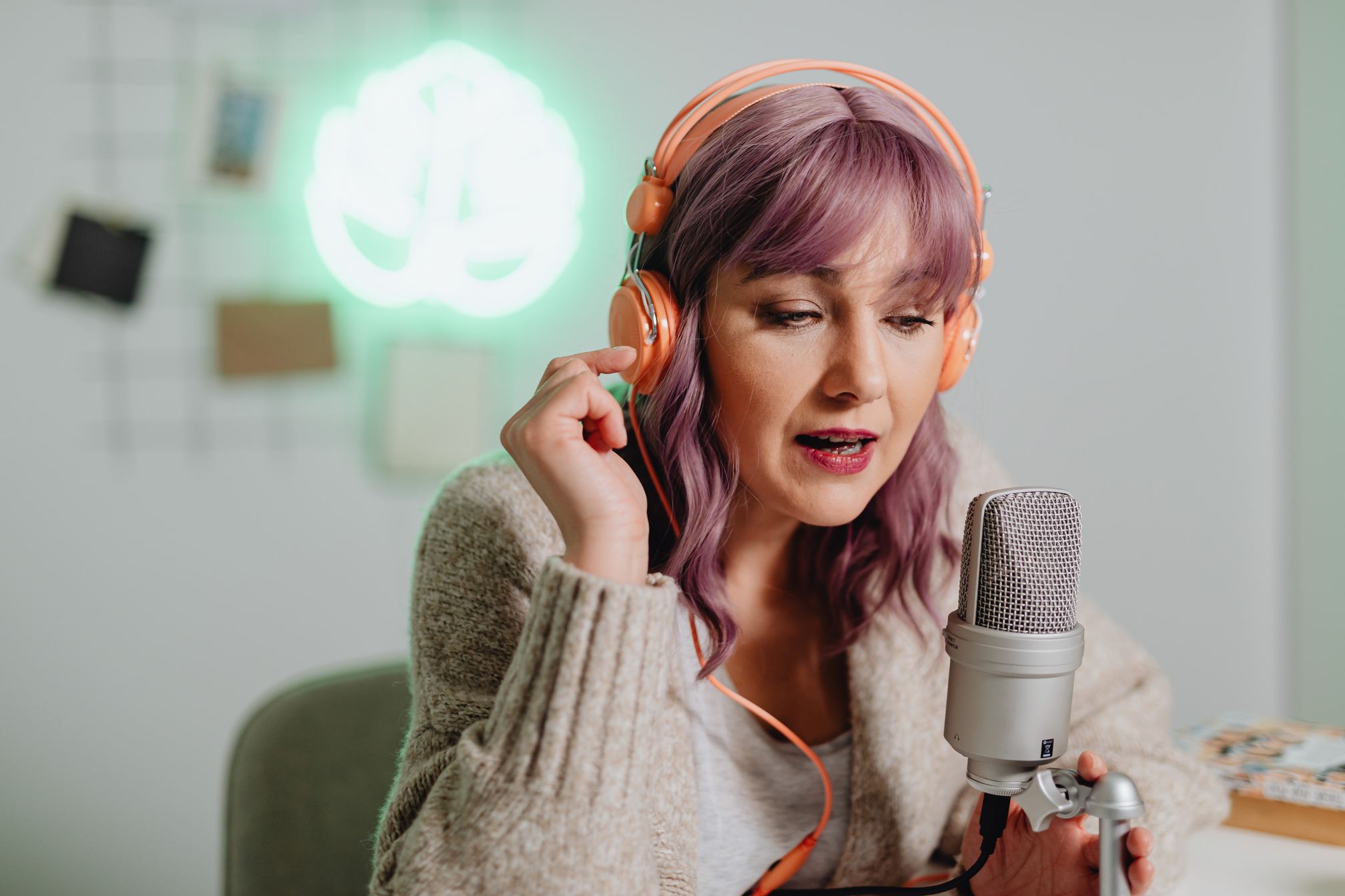 A Woman Talking on a Microphone while Wearing a Headset